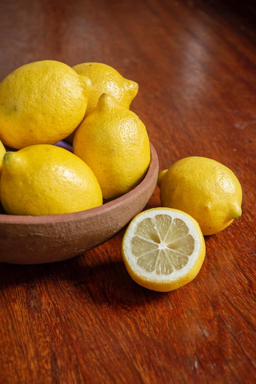 Pilot Plumbing Can You Place Lemon Peels Down Your Garbage Disposal Bowl of Lemons on a Counter